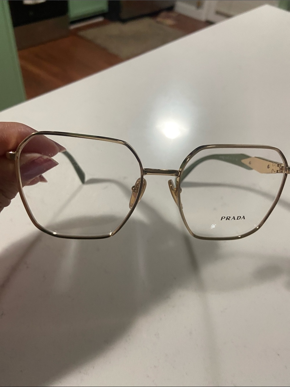 Prada Gold Hexagonal Metal Frame Glasses with Clear Lenses and green arms